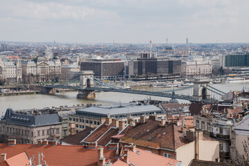 A panoramic view of the city of Budapest in Hungary over the river Danube with the Széchenyi Chain Bridge as seen from Buda Castle.