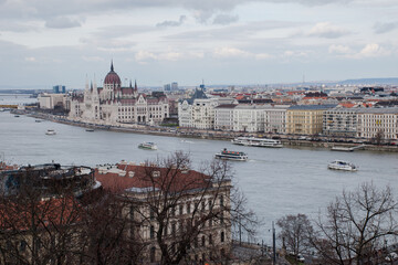 Obraz premium A panoramic view of the city of Budapest in Hungary over the river Danube as seen from Buda Castle; with the parliament building.