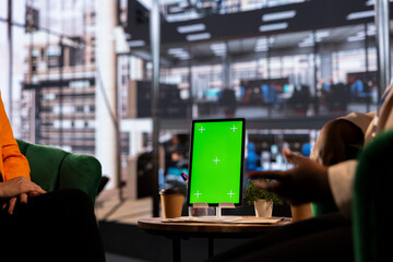 Team of goal oriented general managers discuss about goals next to copy space, using their...