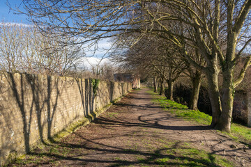 Footpath and trees along the ramparts in Bergues, northern France