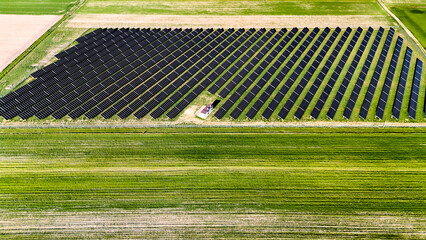 Aerial View of Solar Panel Rows on Agricultural Land — Renewable Energy in Rural Landscape © Alexander