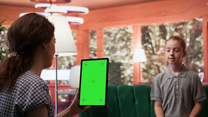 Adolescent in therapy session focused on mental health next to isolated mockup screen, works on emotional well being. Psychotherapist supporting the teen to manage anxiety and depression. Camera B.