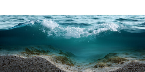 A wave is crashing on the shore. The water is blue and the sand is white. The wave is very large and is crashing into the shore .The ocean in section, the sea is rectangular.