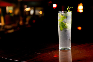 drink mojito with mint ice with blurred pub background