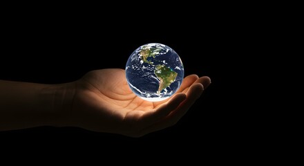A hand gently holds a glowing Earth, symbolizing care and the future of our planet.