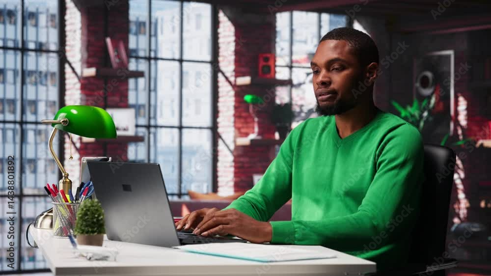 Poster man at home desk using laptop and checking emails displayed on screen, reading messages in inbox and
