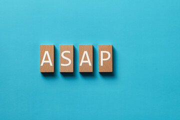 There is wood block with the word ASAP. It is an abbreviation for As soon as possible as...