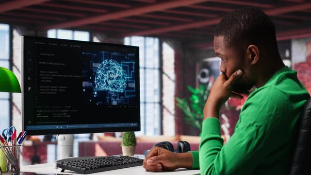 African american engineer coding a neural network AI brain model for machine learning and deep learning, solving IT support tasks on pc. Debugging software and checking for errors. Camera A.
