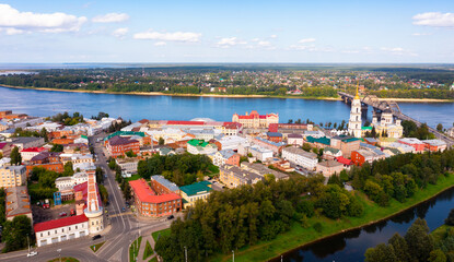 Aerial view of the administrative center of the city of Rybinsk with the Transfiguration Cathedral, as well as the original ..road bridge over the Volga River on a summer day, Russia