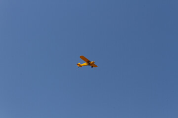 Yellow airplane in flight