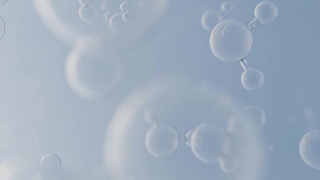 Clear water molecules floating up in front of peaceful blue background. H2O bubble animation for science or environment video. Seamless loop.