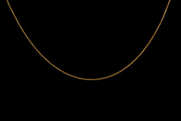 Gold jewelry chains set on black background. 