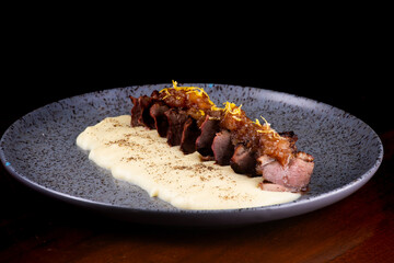 duck magret served with parmesan cream and angled apricot jam