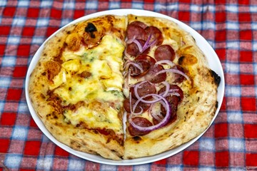 The most authentic Brazilian pizza, half pepperoni, onion and half four cheeses
