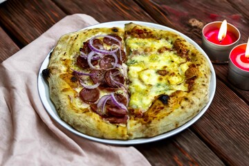 The most authentic Brazilian pizza, half pepperoni, onion and half four cheeses
