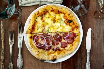 The most authentic Brazilian pizza, half pepperoni, onion and half four cheeses