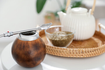 Traditional yerba mate tea on white table indoors, closeup