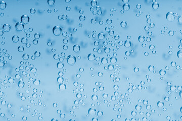 Soda water with bubbles as background, closeup
