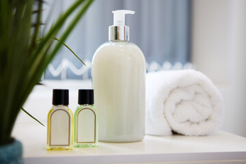 Hotel, lotion and bottle of soap in bathroom at luxury accommodation for travel, vacation or...