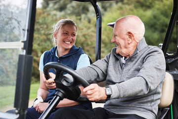 Fototapeta premium Woman, man and happy in golf cart on field, driving and senior person at training, game or exercise. People, buggy and outdoor at club for sports, conversation and transport on grass in retirement