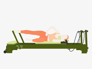 A woman who is lying on her shoulder and doing Pilates Reformer exercises