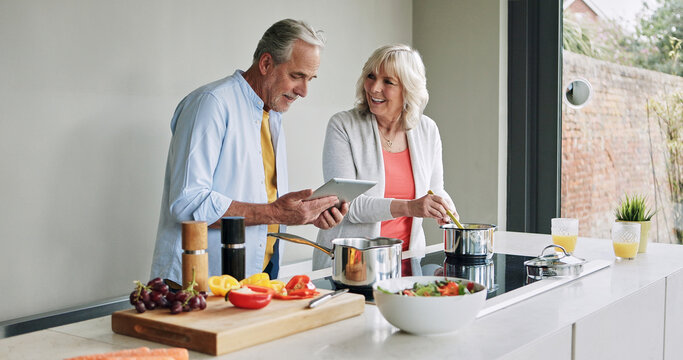 Senior, couple and cooking in kitchen with tablet for meal prep, recipe idea and digital menu with smile. Elderly, man and woman with technology at home for healthy food ingredients and diet planning