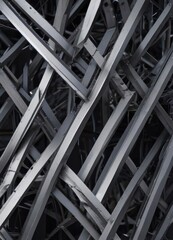 Sleek, intersecting metal lines form geometric shapes; cool, industrial texture , pattern, grey