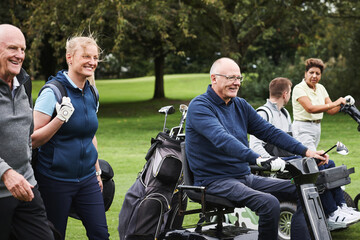 Sports, people with disability and friends for golf game, match and competition on golfing course. Recreation, mobility scooter and women and men with club for training, fitness and practice on field © peopleimages.com