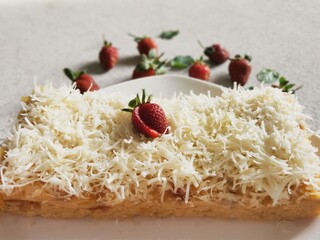 Steamed brownies with cheese and strawberry on top