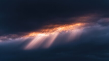 Obraz premium Cinematic landscape with dark stormy clouds and rays of sunshine.