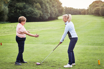 Fototapeta na wymiar Sports, golf and woman with personal trainer on field for game, competition and practice on golfing course. Fitness coach, equipment and people with club for training, match and learning outdoors