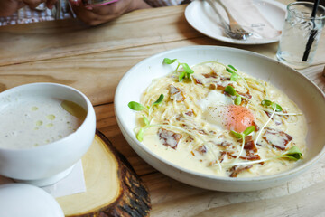 Spaghetti Carbonara topped with Egg Yolk
