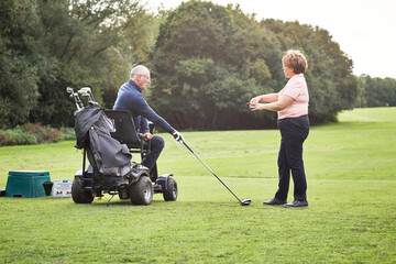 Golfer handicap, sports and old man with coach outdoor on green of course for training or...