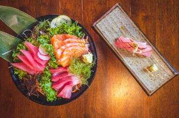 Savoring fresh sushi and sashimi platter in a cozy restaurant culinary delight indoor overhead view gourmet experience