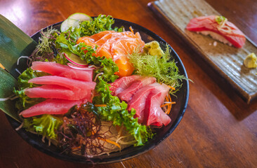 Savoring fresh sushi salad traditional japanese restaurant culinary delight cozy atmosphere close-up gastronomic experience