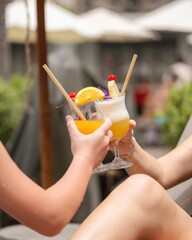Refreshing cocktails cheers between friends at a vibrant poolside bar summer vibes leisure setting inviting atmosphere