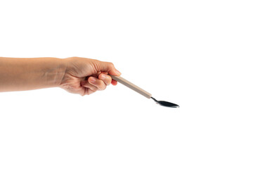 Hand and metal white spoon on transparent background.