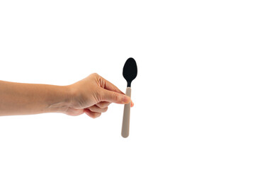 Hand and metal white spoon on transparent background.