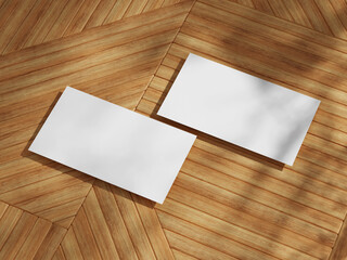 Professional business card mockup on wooden surface with sharp diagonal lines and clean white space for branding.