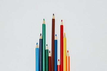 colored pencils on a white background