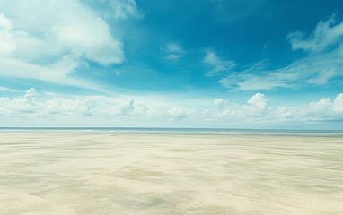 Expansive empty beach under vast blue sky, award-winning wide-angle photography with golden sand textures in brilliant sunlight.