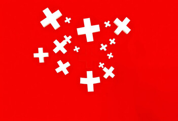 Fototapeta premium Medical Cross Symbols on Red Background