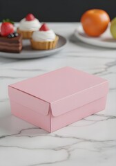 Mockup of a food box made of 16 cm long, 16 cm wide, and 7.5 cm high pink cardboard on a white marble table.