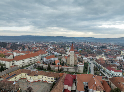 Aerial view of Aiud Nagyenyed fortified protestant church in Romania with walls and towers in the middle of the town