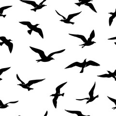 Seamless pattern featuring elegant seagull silhouettes