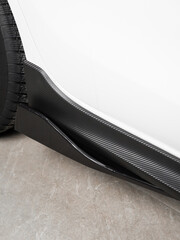 Tuning close-up, black decorative trim on the threshold of the lower door of a sports car