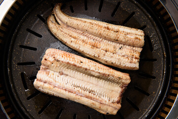 Grilling eel on the grill
