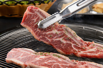 Grilling ribs on a brazier
