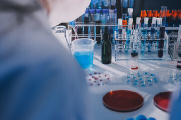 Researcher using a professional microscope