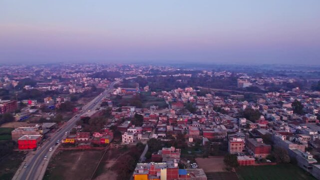 Farming land with SHRI UDASIN SANGAT RISHI ASHRAM and Independent houses at day time, moving up, circle shot, drone shot, 4k.